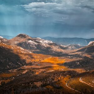 Late light floods a valley below Sundance Mountain in Estes Park, Colorado.